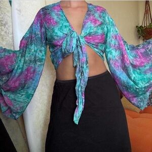 Handmade silk bell sleeve top with metallic detailing.